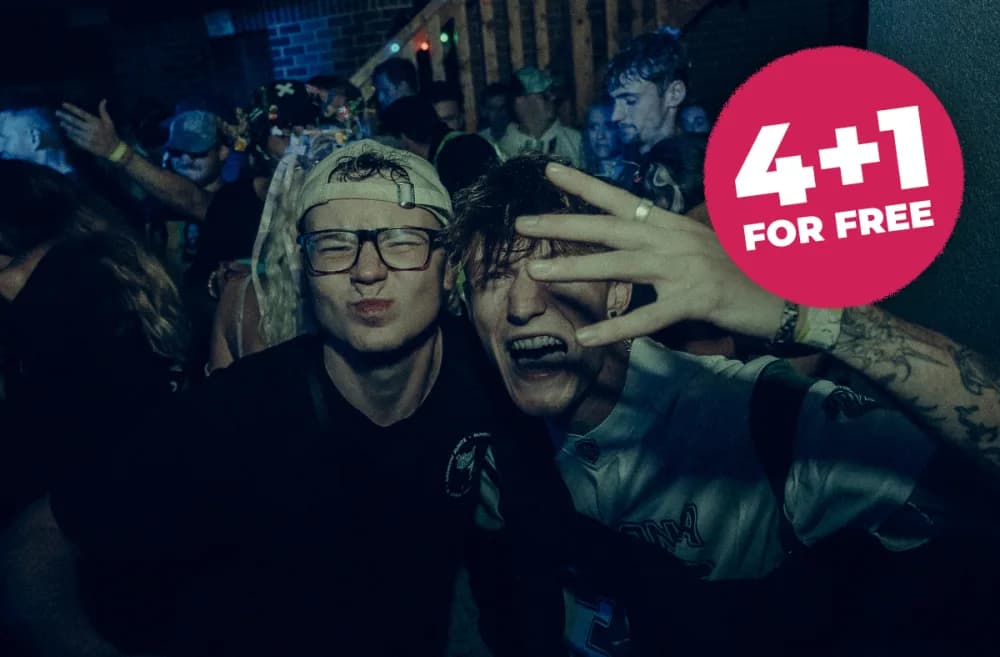 Group of friends celebrating together in the festival crowd